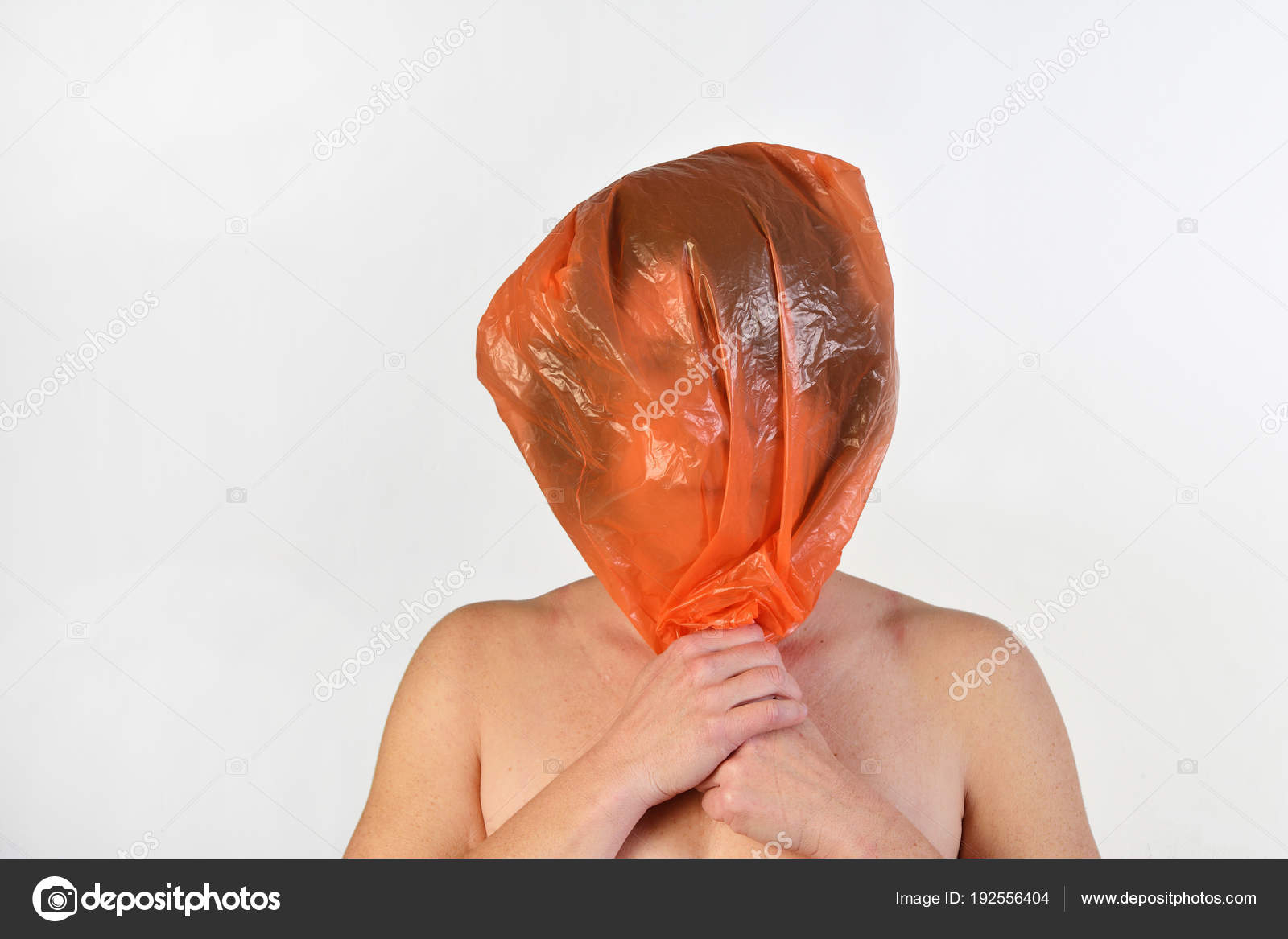 Woman with a plastic bag on her head Stock Photo by ©MariaiC 192556404