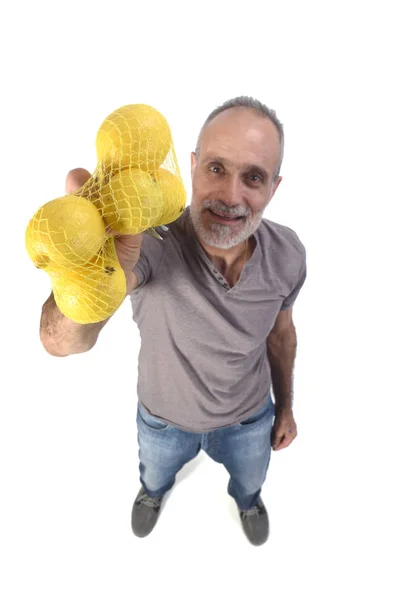 Férfi citromos gyümölcs fehér háttér — Stock Fotó