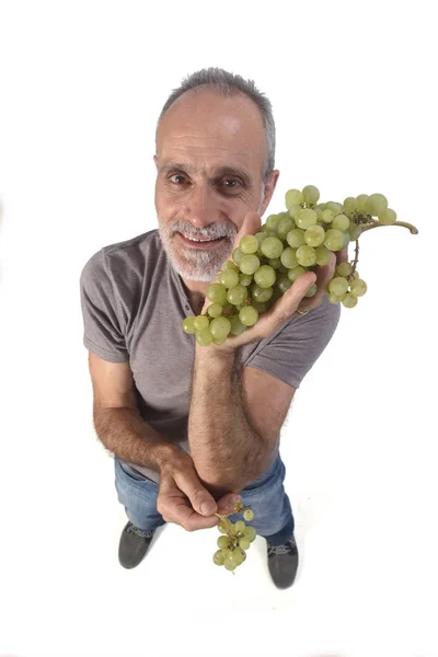 Férfi szőlő gyümölcs fehér háttér — Stock Fotó