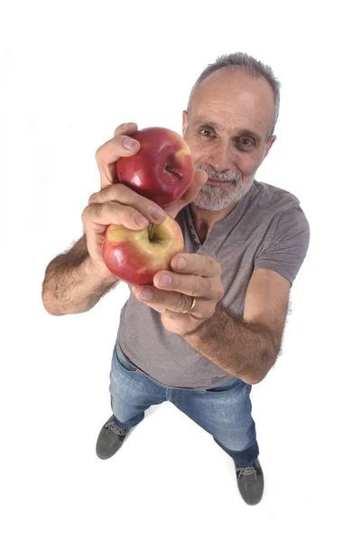 Man med rött äpple på vit bakgrund — Stockfoto