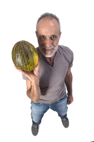 Homem com melão no fundo branco — Fotografia de Stock