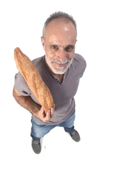 Homem com pão sobre fundo branco — Fotografia de Stock