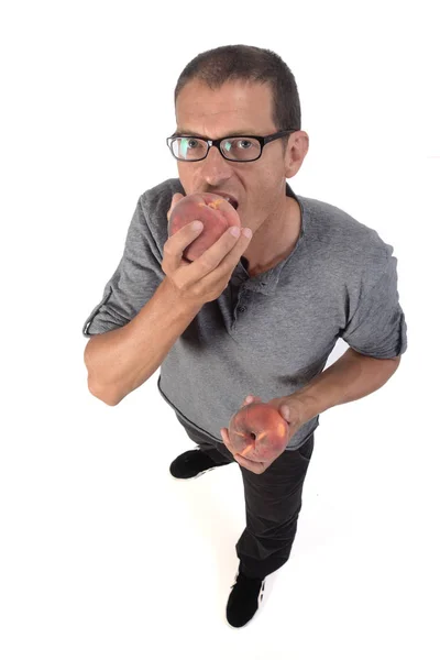 Mann mit Pfirsich auf weißem Hintergrund — Stockfoto