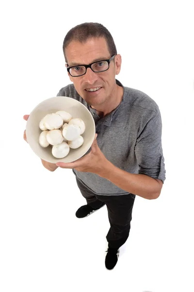 Homem com cogumelo no fundo branco — Fotografia de Stock