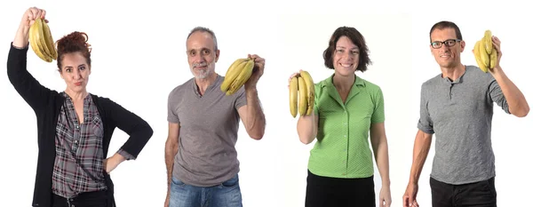 Skupina lidí s banánem na bílém pozadí — Stock fotografie