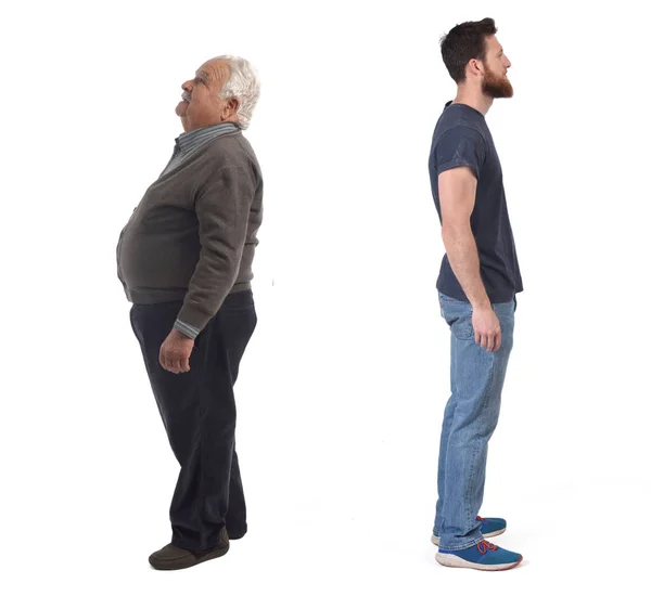 Homem idoso com barriga e jovem sem barriga — Fotografia de Stock