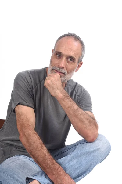 Portrait of middle aged man sitting  on white — Stock Photo, Image