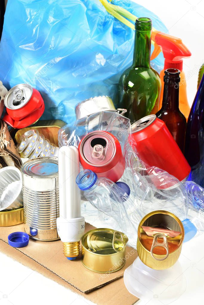 garbage consisting of cans, plastic bottles, glass bottle, carto