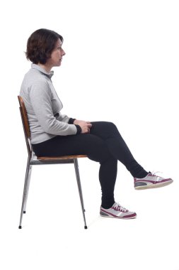 portrait of a woman sitting on a chair in white background, look