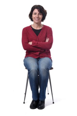portrait of a woman sitting on a chair on white background, arms
