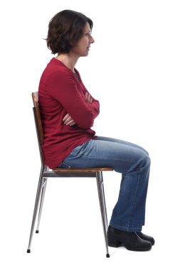 portrait of a woman sitting on a chair in white background,look 