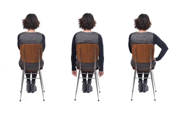 Διάφορους τρόπους κάθεται σε μια καρέκλα πίσω όψη, γυναίκα με φόρεμα — Φωτογραφία Αρχείου