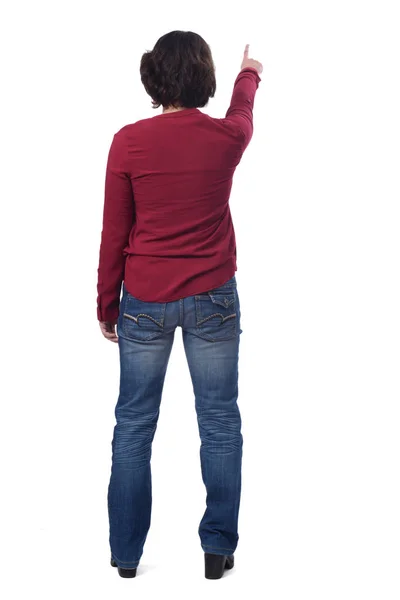 Kvinna som pekar på vit bakgrund — Stockfoto