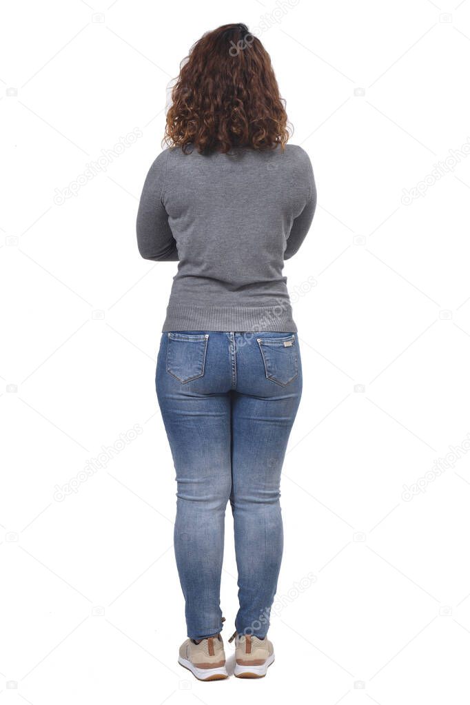 full portrait of a woman from behind arms crossed on white background