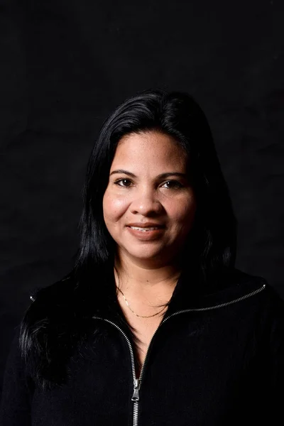 portrait of a woman on black background,