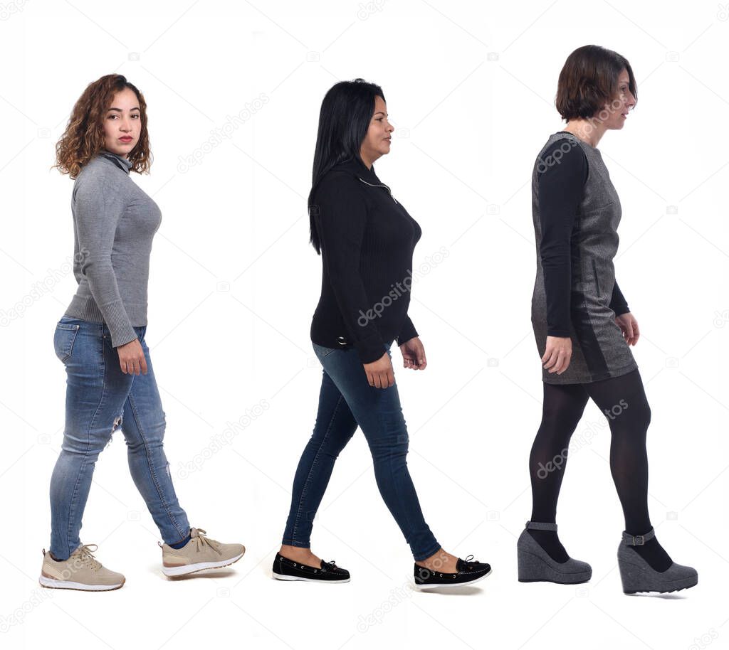 group of women waling on white background, side view