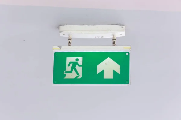 Emergency exit sign isolated on white background. - Selective Fo — Stock Photo, Image