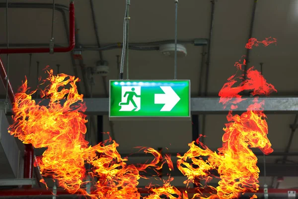 Fire exits in car park area and frame of fire burn. — Stock Photo, Image