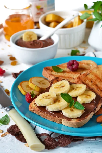 Good morning - toast with Nutella, banana and honey. White food — Stock Photo, Image