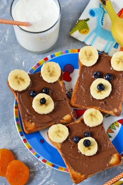 Breakfast for children - toast with chocolate paste, banana — Stock Photo, Image
