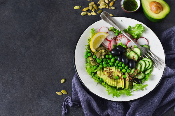Vegan vegetable salad with flax seeds and olives 