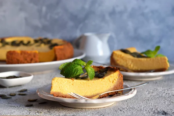 Slice of pumpkin cheesecake with seeds