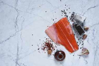 Salmon carcass, piece of salmon on a marble background.