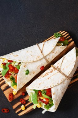 Mexican tortilla with beef, vegetables and chili 