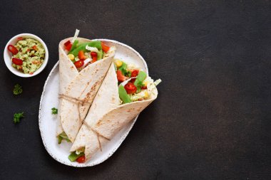 Mexican tortilla with beef, vegetables and chili 