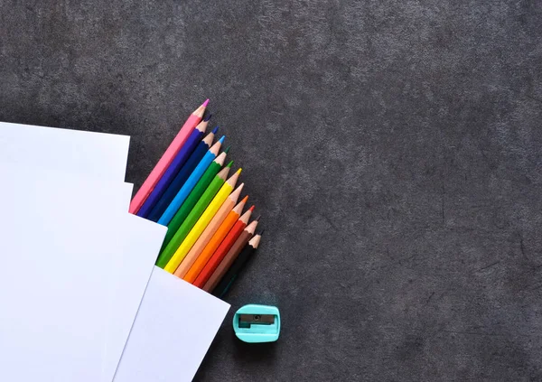 Set for drawing, color pencils, paper. View from above. Office tools.