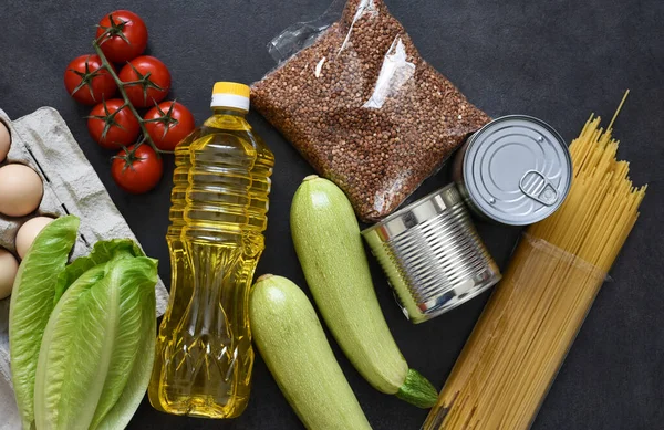 Home delivery food. Main dishes: butter, pasta, buckwheat, eggs, greens. Stay at home.