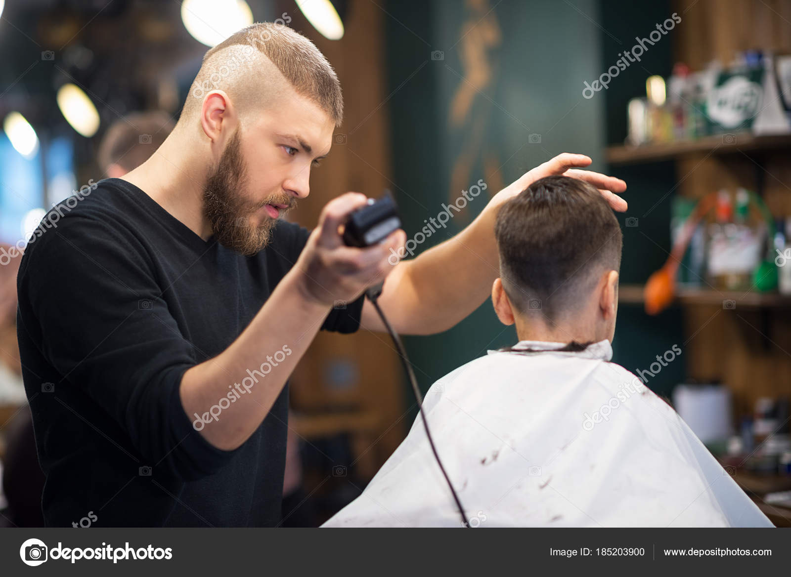 The Young Man The Hairdresser Cuts The Schoolboy In Hairdressing