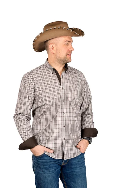 The man's portrait in a cowboy's hat. Stock Photo