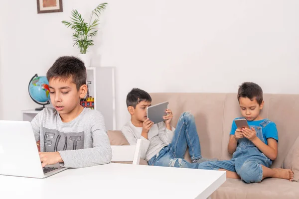 Children of different ages use gadgets for games, communication