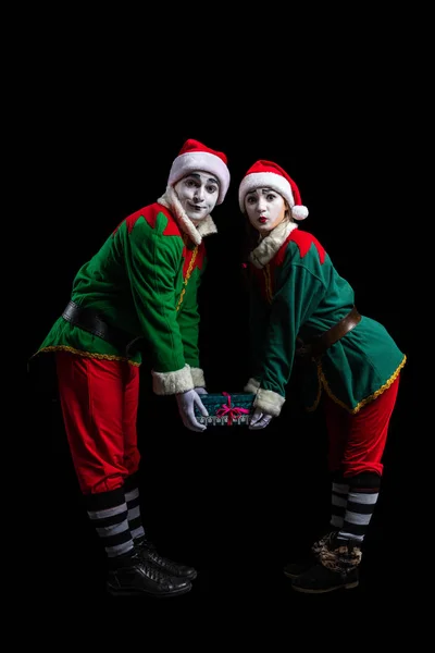 Couple of New Year elf mimes isolated