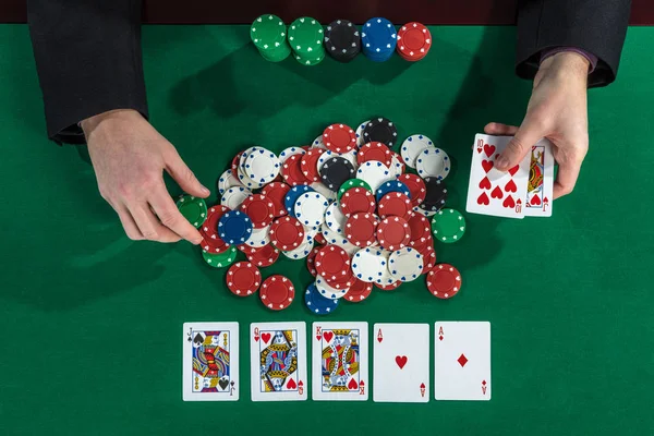 Up view of poker player hands on gambling table — Stock Photo, Image