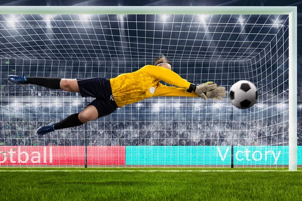 Female goalie is jumping for the ball on crowded stadium — Stock Photo, Image