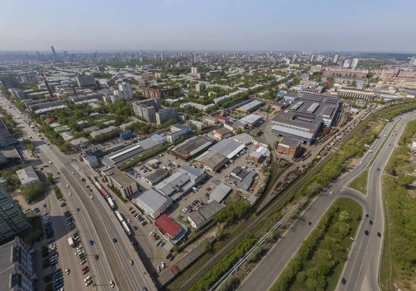 Industrial area and Malysheva street in Yekaterinburg city, Russia. Aerial, summer, sunny — Stock Photo, Image