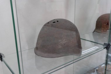 Sukhoy Log, Russia - june 26, 2019: holey helmet of a Soviet soldier. Title 