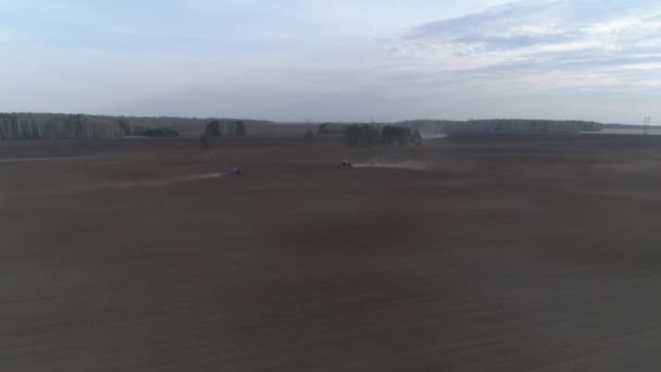 Two Tractors Plow Huge Field Spring Evening — Stock Video