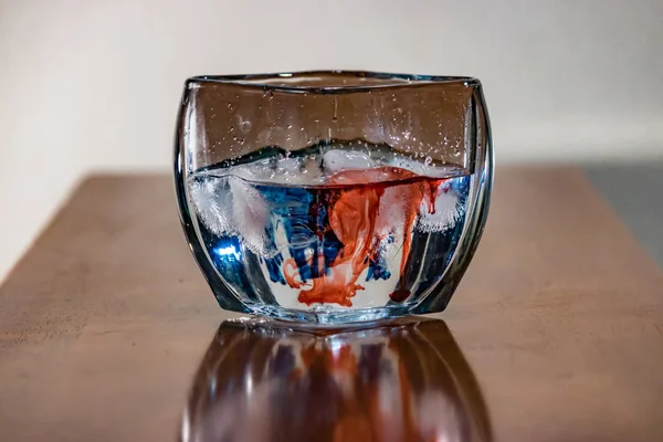 red and blue dye in water