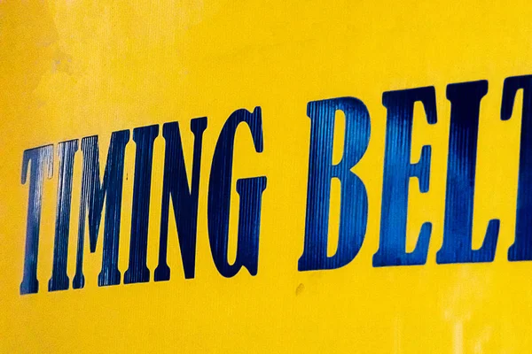 advertising sign with bold bright reflective blue letters