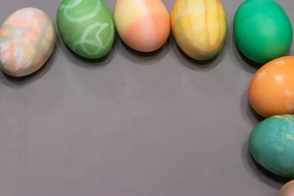 Colorful dyed easter eggs aranged into a square — Stockfoto