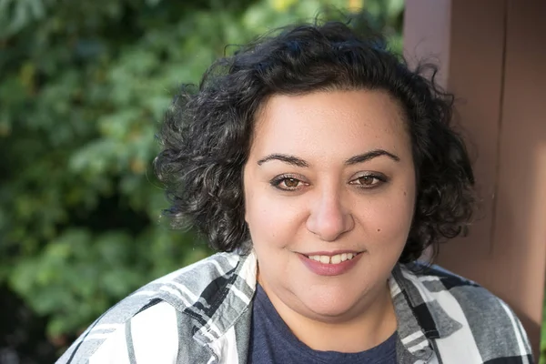 Middle aged mixed race woman standing outside with big smile — Stock Photo, Image