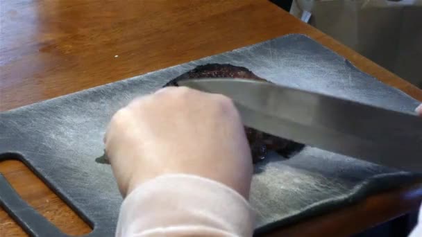 Pork chops out of the oven in preparation for breakfast — Stock Video