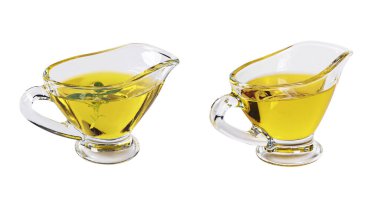 Beyaz arka planda izole edilmiş zeytinyağı ve fesleğen yapraklı cam sos kabı