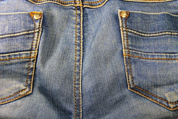 Текстура джинсов. Часть синих джинсов — стоковое фото