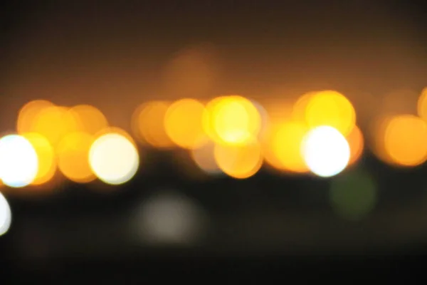 Abstract background of blurred city lights with bokeh effect — Stock Photo, Image