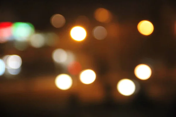 Abstraktní pozadí rozmazaných městských světel s efektem bokeh — Stock fotografie