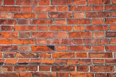 kırmızı tuğla duvarın arka 